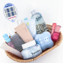 Basket of curated K-beauty skincare and makeup products labeled as “team baerry staff picks,” featuring pastel-toned bottles, creams, and serums arranged in a cozy, aesthetic display.
