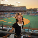 at the ballpark looking at the camera in the afternoon sun