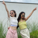Two girls with sunglasses wearing k-beauty sunscreen
