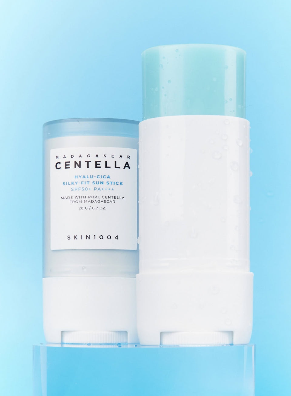 Twisting up Korean centella hyaluronic acid sun stick for half-show SPF reapplication at stadium concert
