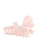 Belle Hair Clip IL503 pink angled view showing comb teeth row and cloud-sculpted top of pearlescent pink resin claw clip