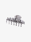 Black Check Hair Pin IL530 black and white plaid side flat view showing clip open position with full row of teeth and plaid acrylic texture detail