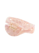 Freya Hair Clip IL503 pink marble side angle view showing inner claw teeth fanned open with gold-tone spring hardware visible
