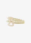 Green Hair Pin IL530 green bottom detail view flat lay showing interior spring hinge mechanism and interlocking teeth rows