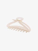 Light Beige Hair Pin IL530 light beige angled side view flat lay displaying open claw structure curved arms and gold coil spring mechanism