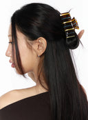 Marin Stripe Hair Pin IL529 brown blue yellow striped acetate claw clip worn on model with long straight black hair in half-up side profile styling