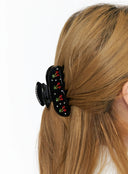 Onyx Berry Black Hair Pin IL529 black close-up on model worn in low half-up style showcasing crystal cherry and rhinestone embellishments on glossy clip body