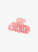 Pink Ribbon Jewel Hair Pin IL530 pink angled side view revealing gold spring hinge mechanism white bow details and rhinestone crystal studs on matte resin