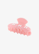 Pink Ribbon Jewel Hair Pin IL530 pink three-quarter angle showing matte resin body white mini bow embellishments scattered rhinestones and open teeth underside